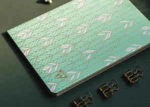 green notebook with leaves