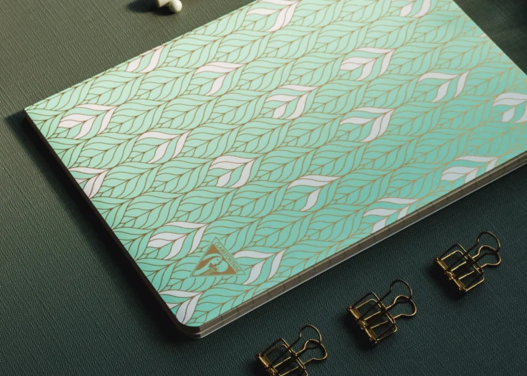 green notebook with leaves