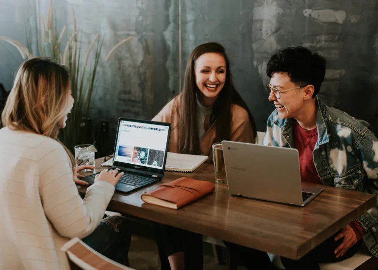 group of people having fun with computers